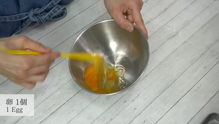 While the pasta cooks, whisk together eggs, Kona cheese, and milk in a bowl until thoroughly combined.