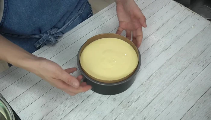 Pour batter into prepared cake mold and tap gently to remove air bubbles. Place mold on a baking sheet lined with kitchen paper and pour hot water into the baking sheet (bain-marie).