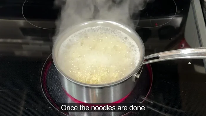 Once the noodles are done, drain them and rinse them briefly under cold water to prevent them from getting soggy and maintain a chewier texture.