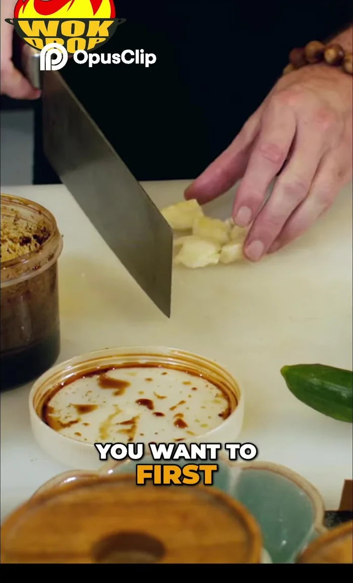 Next, start dicing the garlic. Don't dice it too finely; a rough chop is preferred.