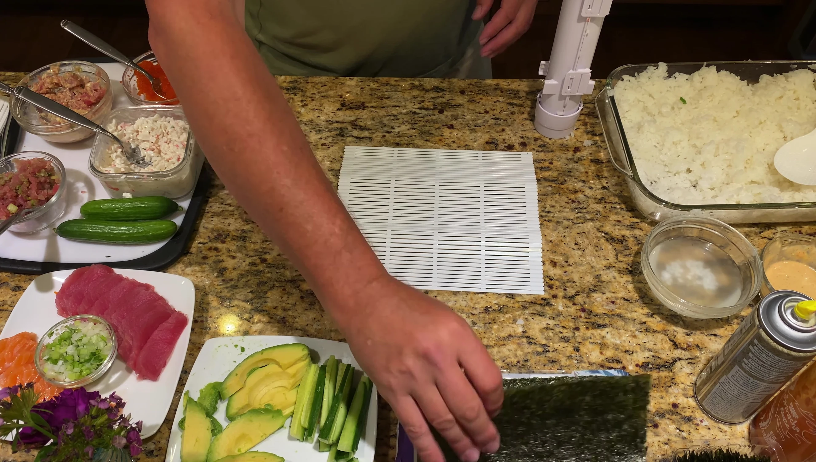 Placing the roll on nori