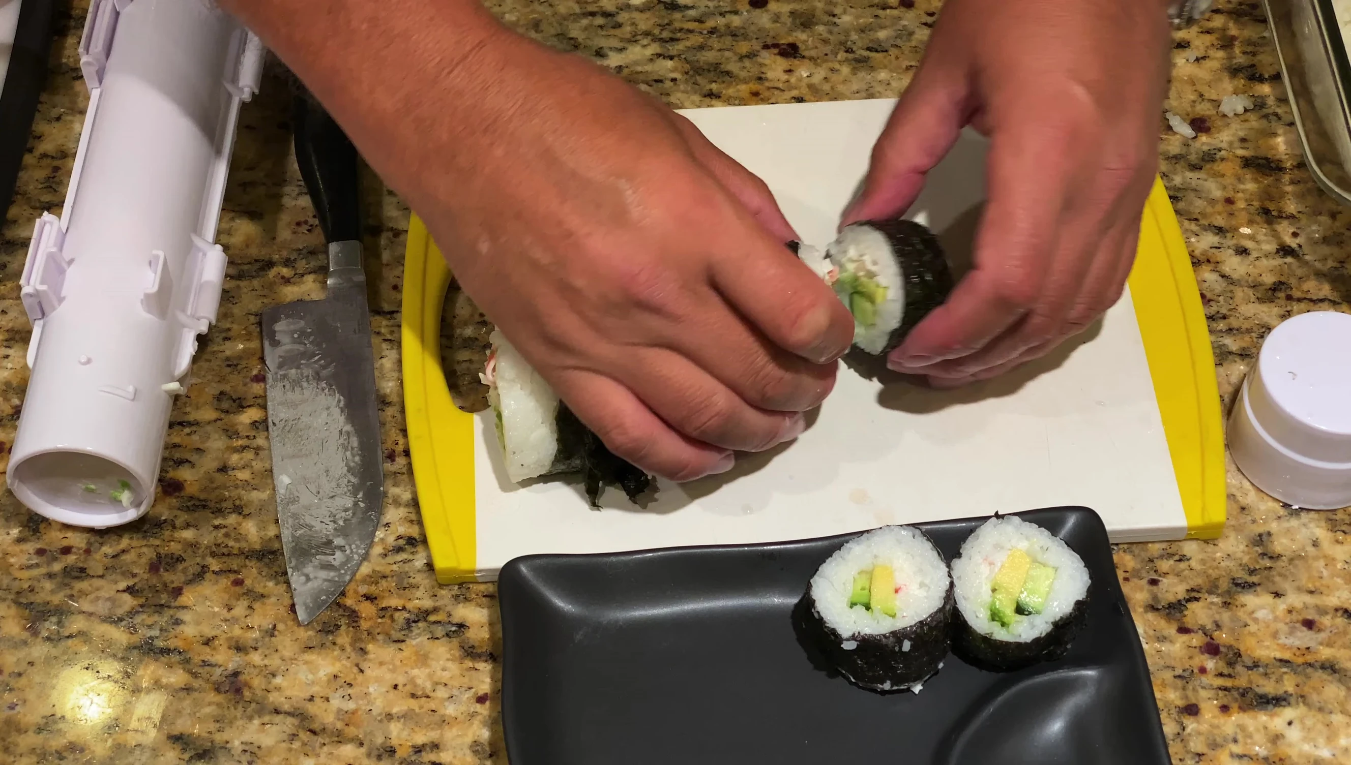 Arranging sushi on a plate