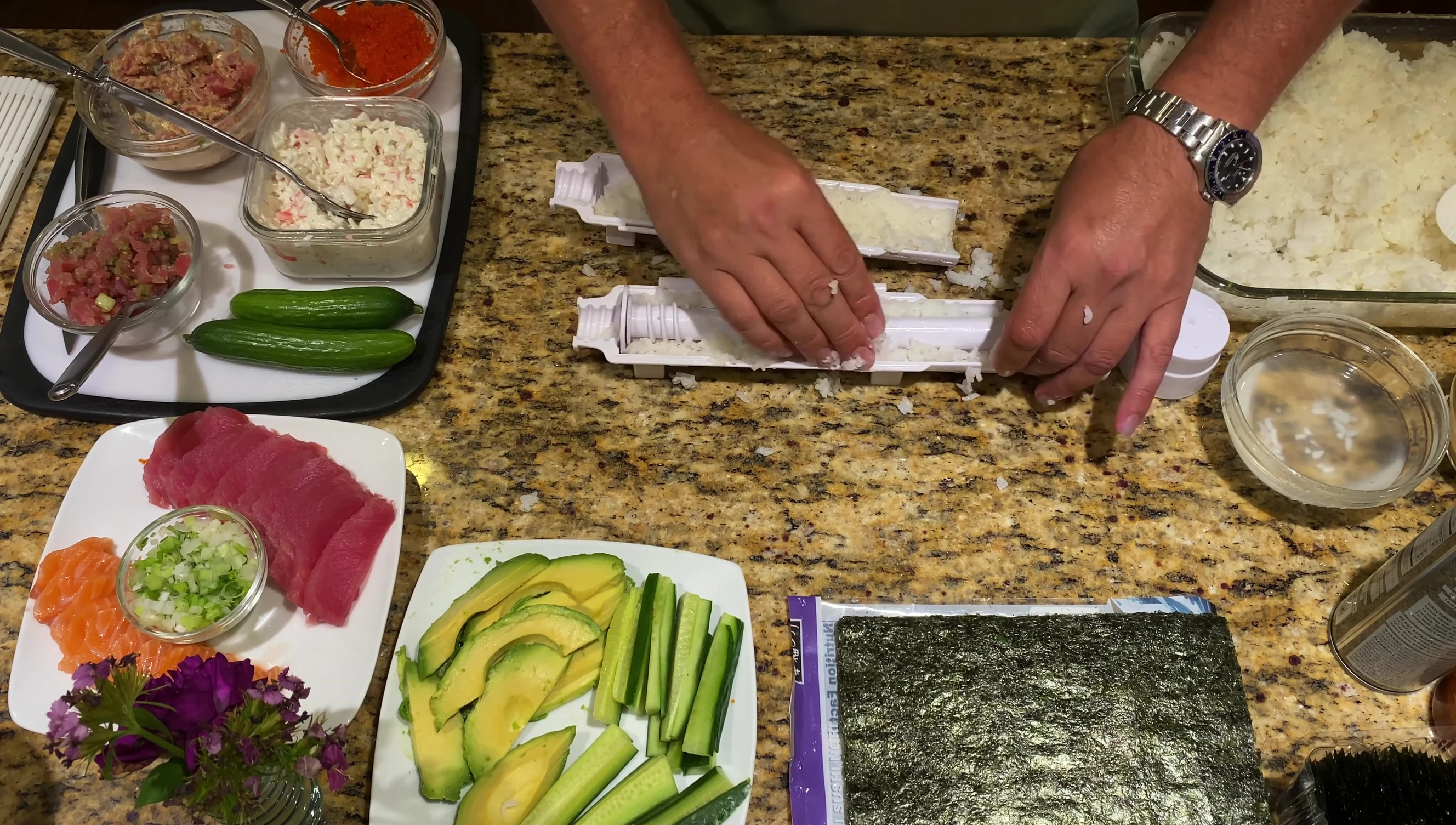 Packing rice into the Sushi Bazooka