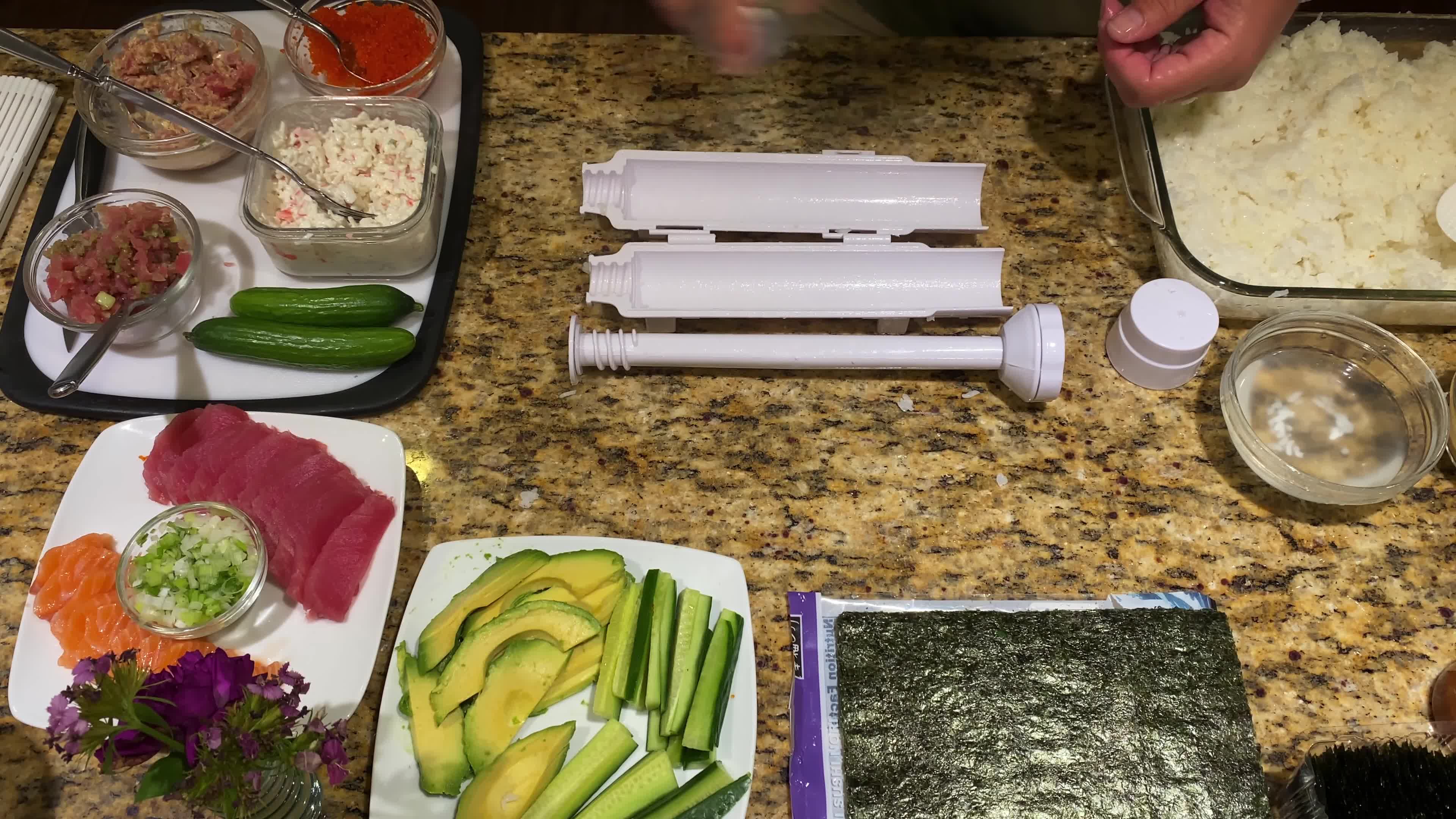 Spraying the Sushi Bazooka with coconut oil
