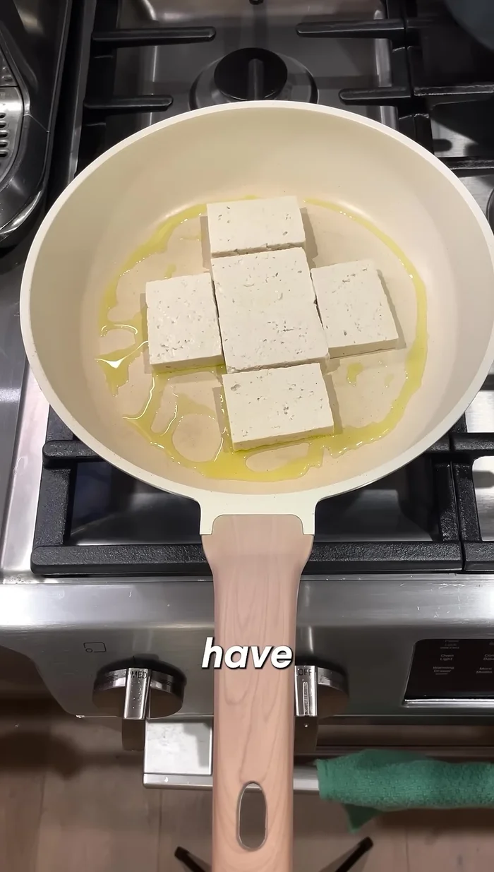 Fry the tofu until golden brown over medium-high heat (5-10 minutes). Don't flip too often for a crunchy exterior.