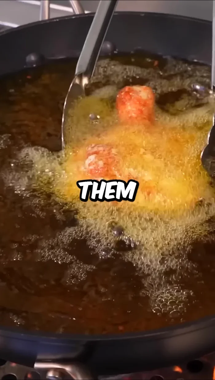 Fry the chicken in batches at 350°F (175°C) until golden brown and crispy.