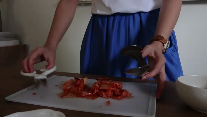 Make Kimchi Hiyayakko: Drain silken tofu (or pat dry with paper towel for 10 min), top with kimchi and sesame oil/seeds.