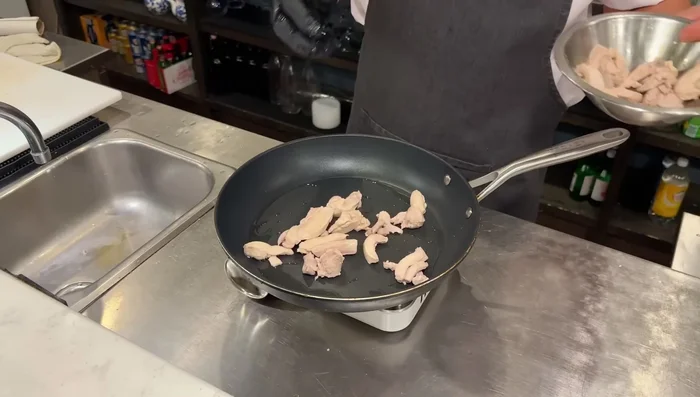 Method 1 (Sauté): Heat a pan with oil. Add the pre-cooked chicken and sauté for 1-2 minutes. Add onion and bell peppers, sauté for another minute. Pour the teriyaki sauce over the chicken and vegetables and cook until heated through.