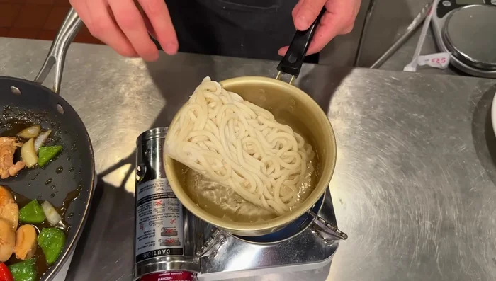 Serve over rice or udon noodles. Garnish with sesame seeds.
