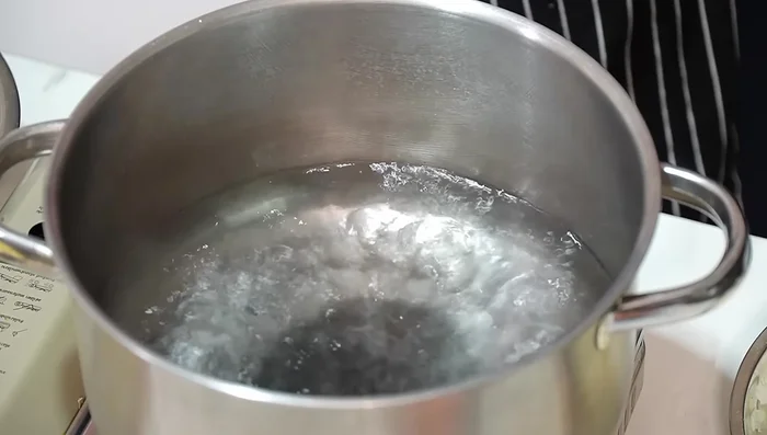 Blanch chicken in boiling water for 4 minutes. Drain and set aside to cool.