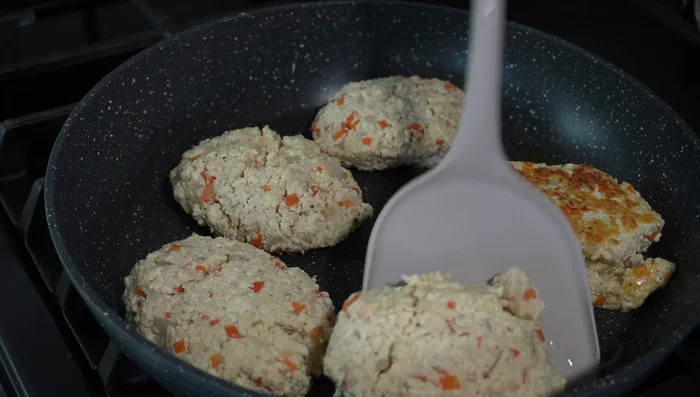 Flip patties, cover with a lid, and steam cook until done.