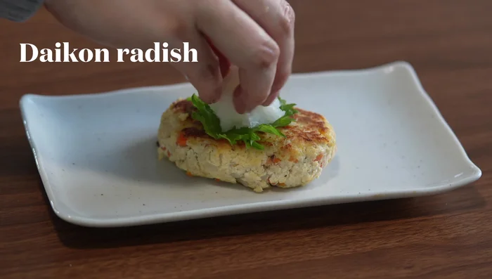 Place patties on a plate, garnish with shiso leaf, grated daikon radish, and ponzu sauce.