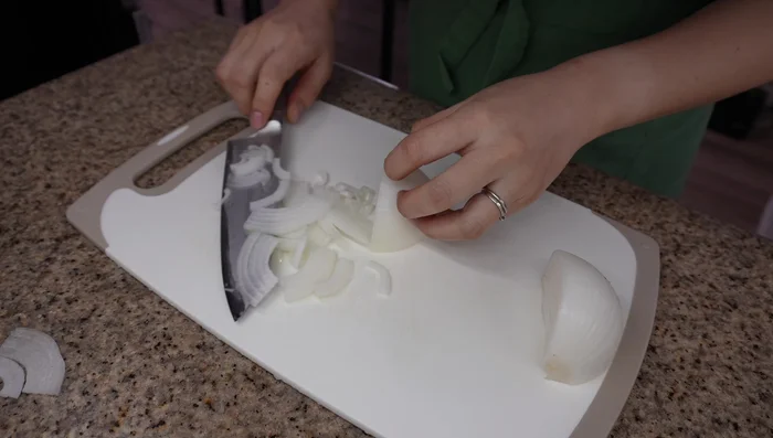 Thinly slice onion into bite-sized pieces. Chop green onions for garnish.