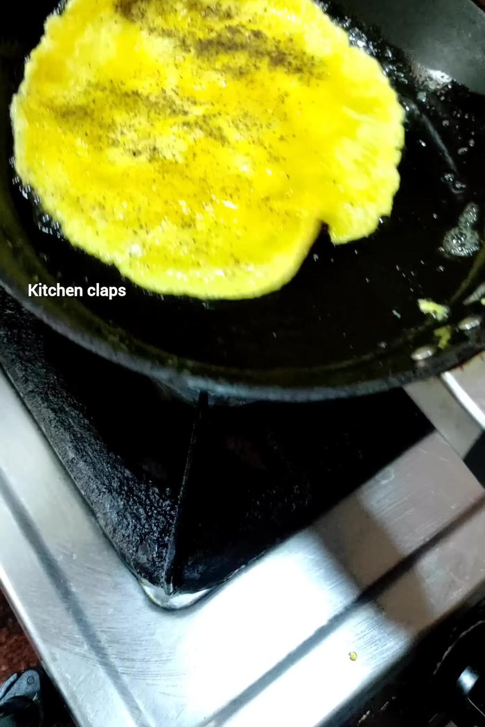 Gently flip the omelette.