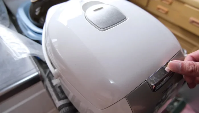 Once the rice is cooked, let it cool slightly. Add a small amount of water to the rice to prevent sticking.