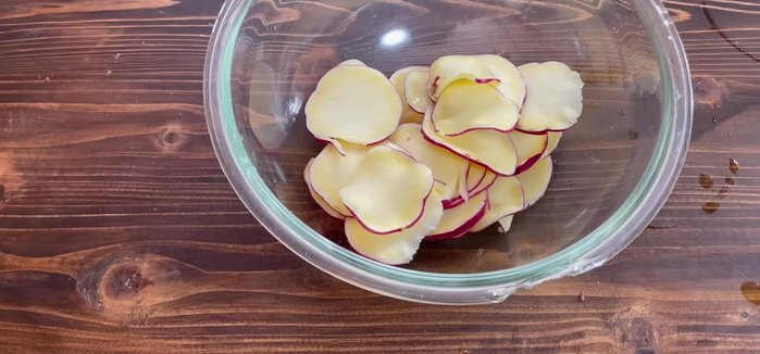 Drain the water from the sweet potato slices.