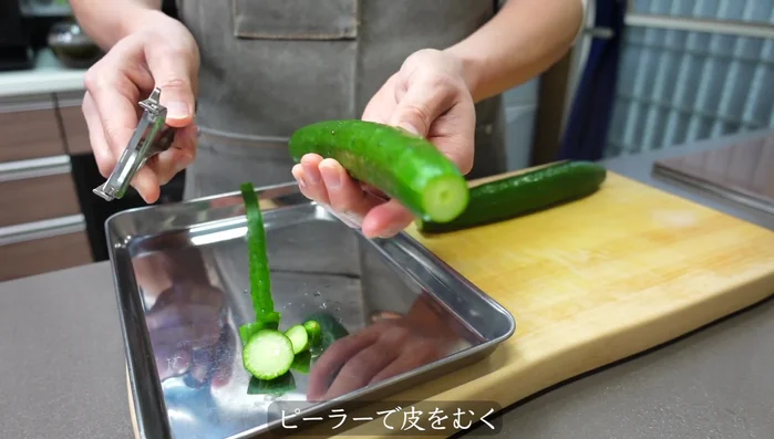 Peel the cucumbers using a peeler, leaving some skin on for texture. Aim for a sashimi-like appearance.