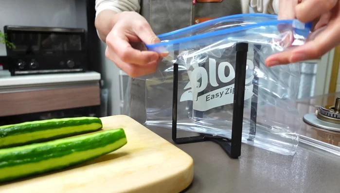 In a ziploc bag, combine the cucumber slices, ginger, sesame oil, white dashi, and a pinch of sugar.