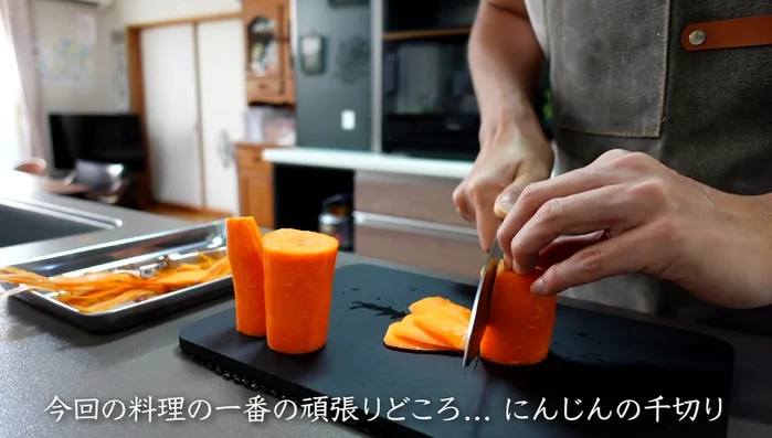 Shred the carrots thinly. Stack several slices before slicing to create thin strips.