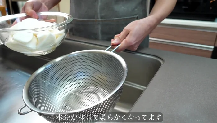 After 20 minutes, rinse the salted turnip stalks under running water to remove excess salt.