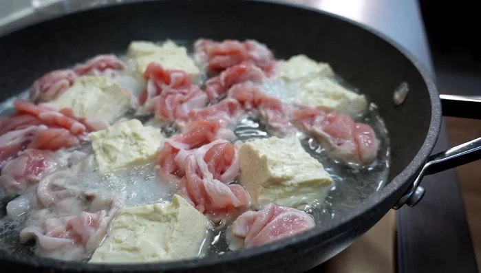 Boil water in a pot and add the pork loin.