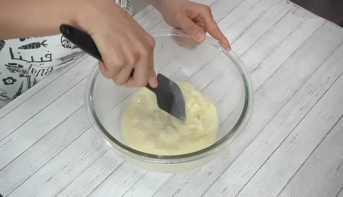 Remove plastic wrap, mash the mochi while mixing. If needed, microwave again in 1-minute intervals, mixing thoroughly between each interval, until the mochi is soft and pliable.