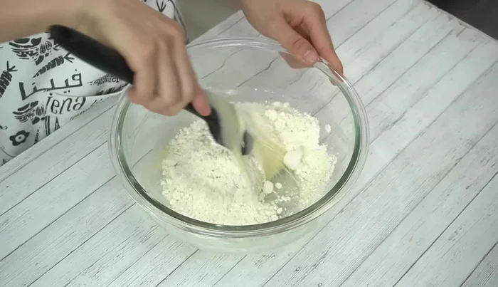 Add all the pancake mix at once and mix until a dough forms. Add more pancake mix if the dough is too sticky.