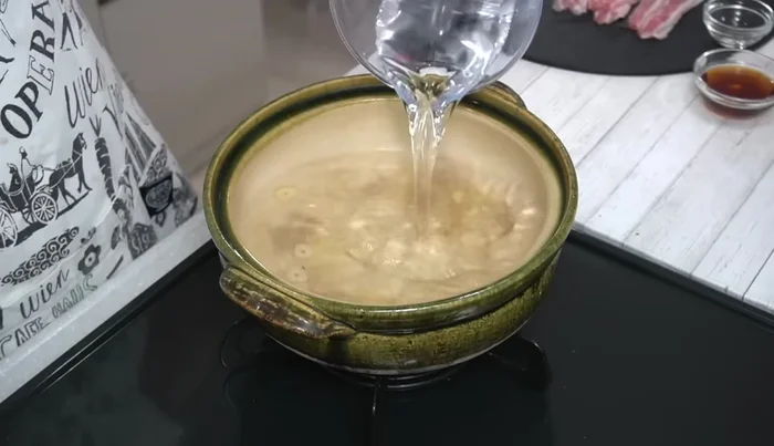 Add water, mirin, and noodle soup base. Bring to a boil.
