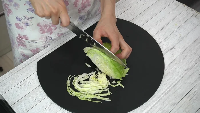 Chop cabbage roughly and onion finely.