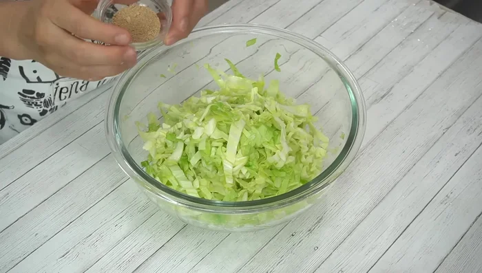 Add dashi stock to the cooled cabbage. Crack in the eggs and mix well with the cabbage.