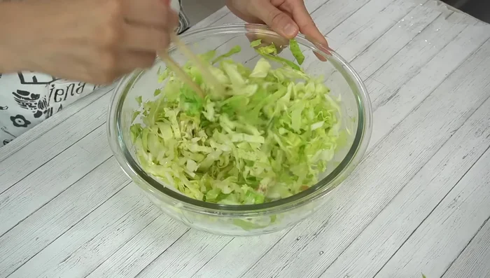 Add a little water to loosen the egg proteins. Mix in tempura scraps and red ginger.