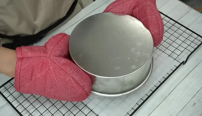 Let the cake cool completely, then remove it from the mold and wrap it in plastic wrap overnight to keep it moist.