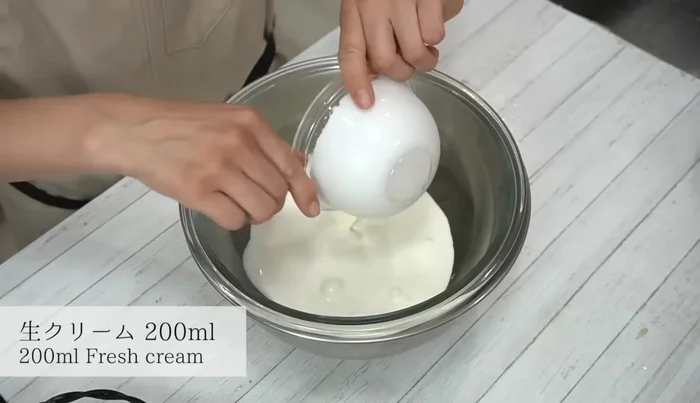 Whip the cream until it forms soft peaks. Set aside half of the cream and whip the other half until it's stiff.
