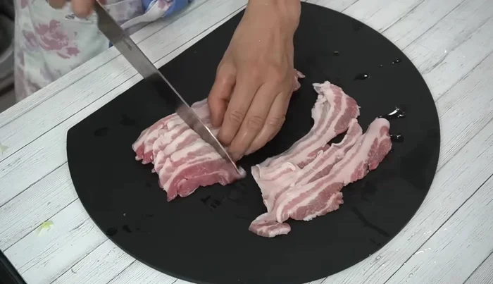 Cut the pork into bite-sized pieces and season with salt and pepper.