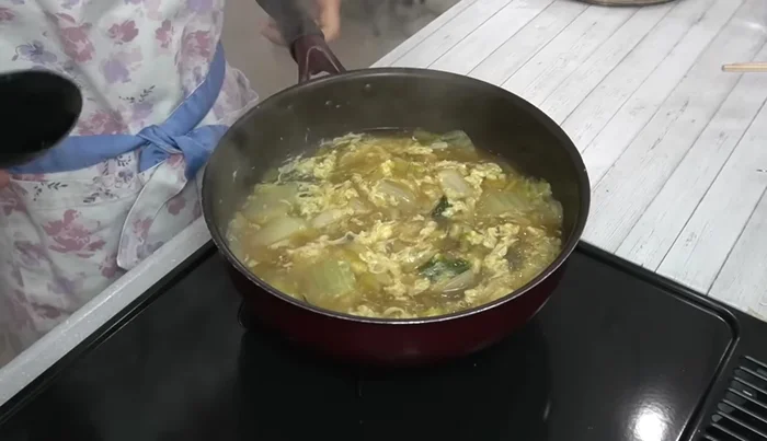 Once the eggs are set, mix lightly. Serve.