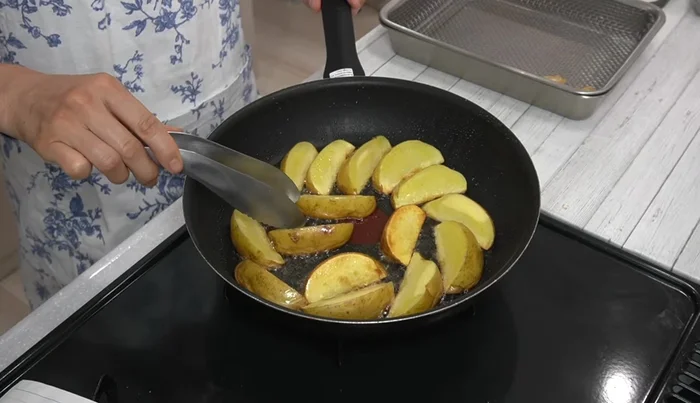 Continue frying the potatoes until golden brown, flipping as needed, ensuring even browning and crispy skin. (Pay attention to timing, and lift the potatoes to expose the skin to air)