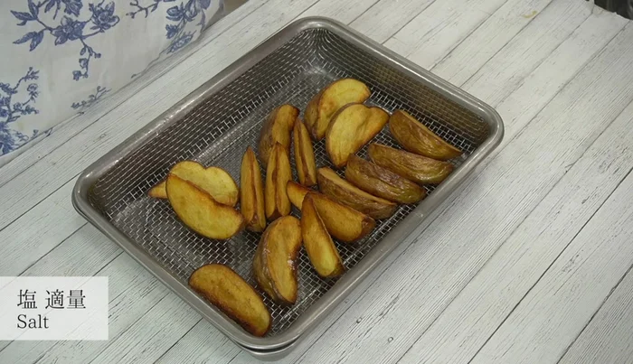Season fries with salt to taste.