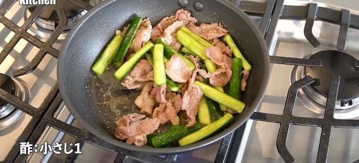 Once the cucumbers are slightly softened and have absorbed the sauce, add vinegar for a tangy flavor. Stir in sesame seeds.