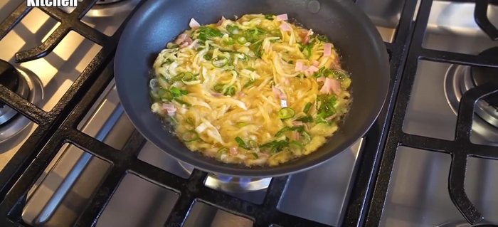 Spread the mixture evenly in the pan, shaping it slightly like a ring. Cook until lightly golden brown.