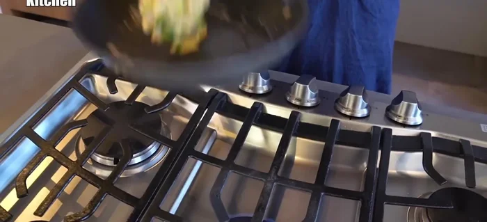 Flip the omelette carefully. It may be stringy, but you can easily adjust it.