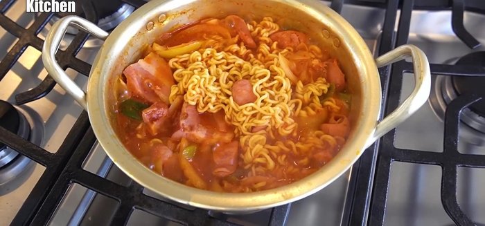 Boil noodles until soft and some broth has evaporated.