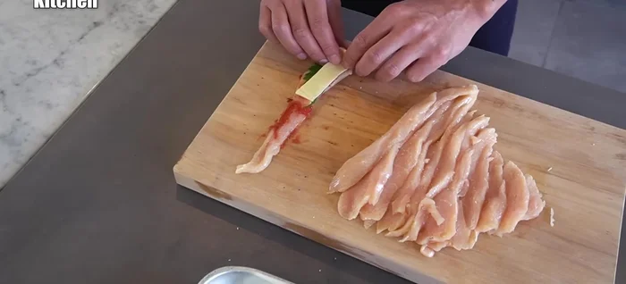 Add shiso and cheese to each slice, then roll up tightly (189.72).