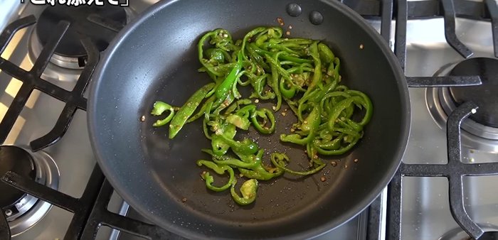 Add grated garlic, soy sauce, and more sesame seeds once the bell peppers are tender.