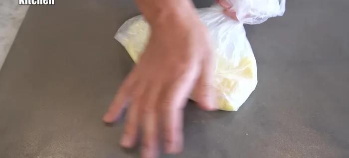 Knead the potato mixture until smooth. Shape it into a flat square within the plastic bag.