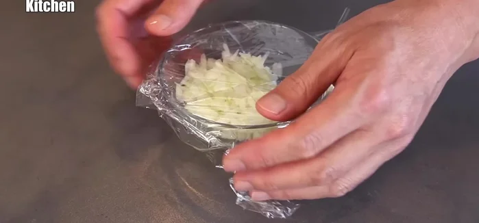 Heat the chopped onions in a microwave-safe container, covered with plastic wrap.