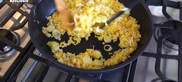 Remove from heat and add green onions, mixing gently.