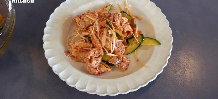 Plate the chilled pork kimchi stylishly and serve with rice.