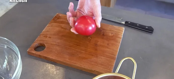 Cut the tomatoes in half, remove the stems, and grate one half.