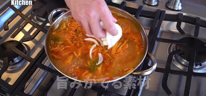 Make the broth: Add onions and cod roe to the pot to create the base soup. Simmer to enhance the flavor.