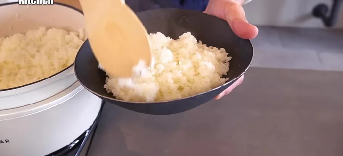 Serve the diced steak over rice, top with onion sauce, pepper, and optional green onions.